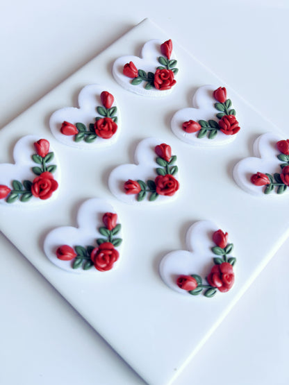 The Heart Rose Floral Polymer Clay Earrings by silverstar.nz feature a funky design with heart shapes, red roses, and green leaves, adding flair to any style.